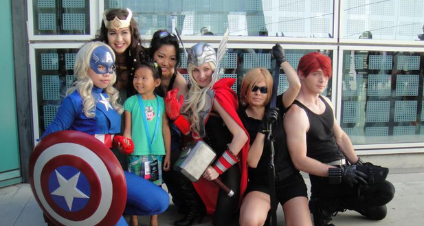 Genderswapped Avengers posing with small girl. 