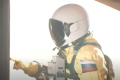 a still of a live-action yellow astronaut from Among Us